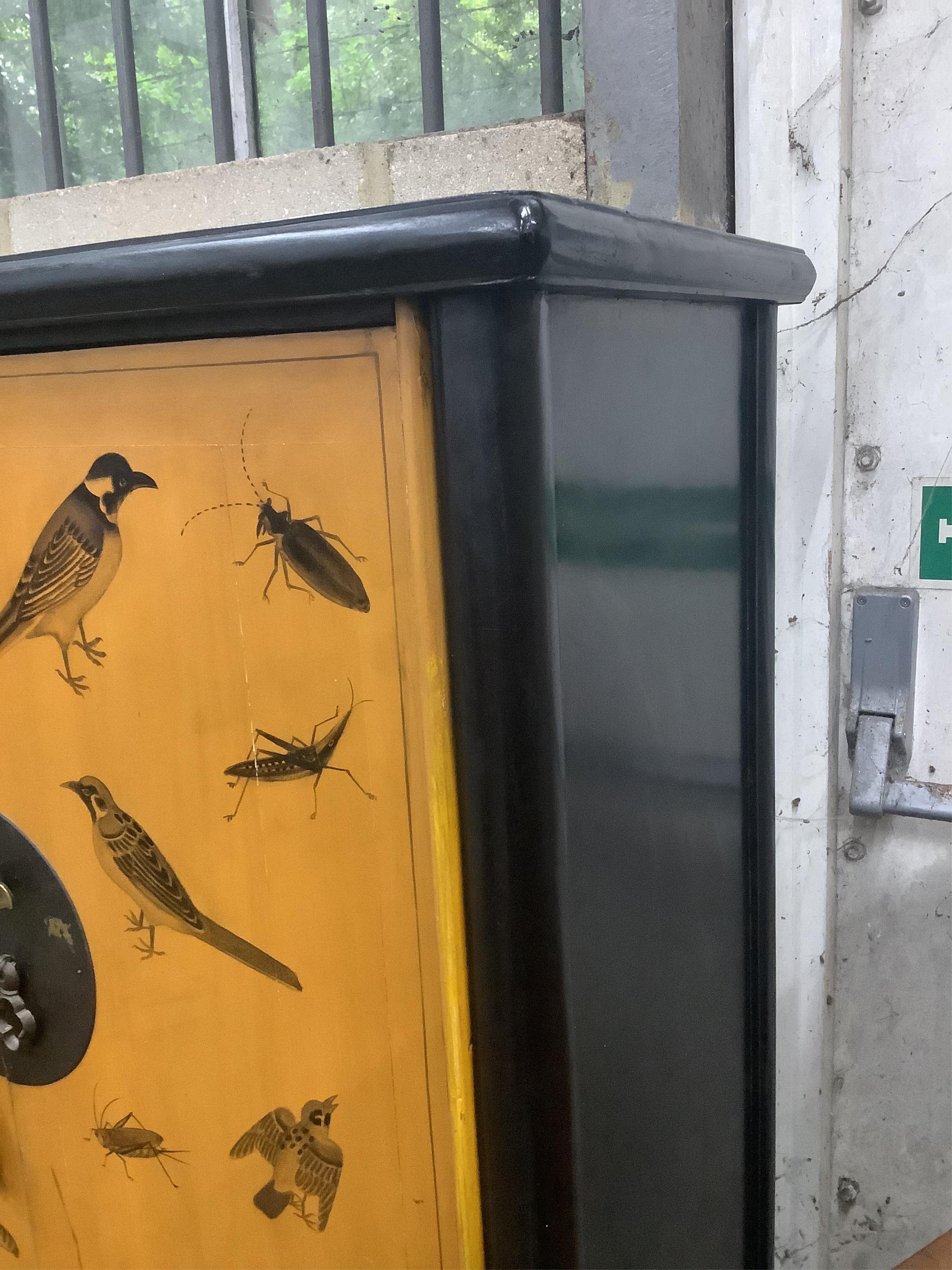 A small modern Chinese two door wardrobe, decorated with birds and insects, width 85cm, depth 45cm, height 140cm. Condition - fair